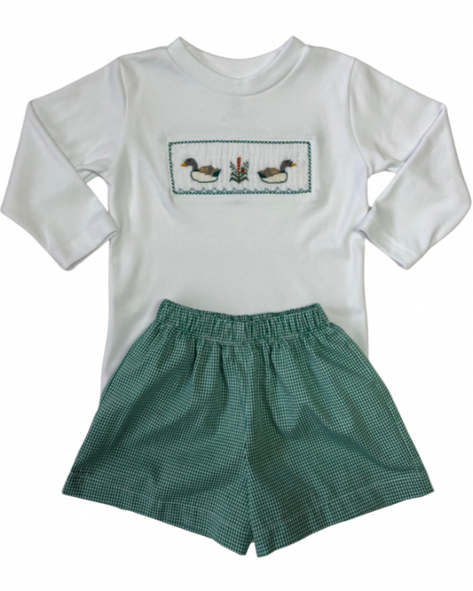 White long-sleeve shirt with duck smocked design and green checkered shorts on a white background