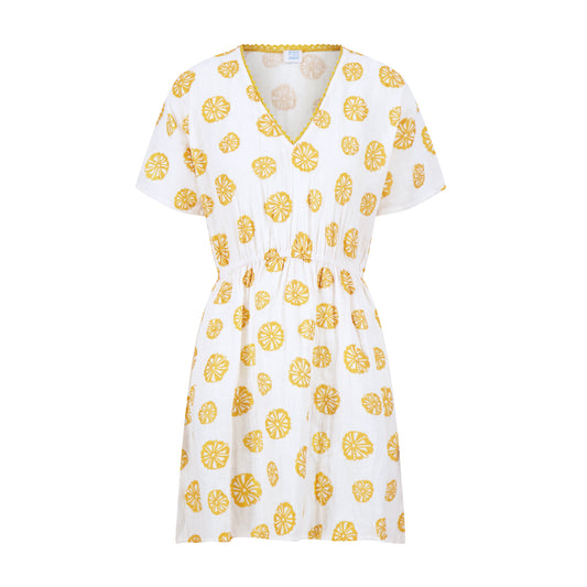 White caftan with yellow sand dollar pattern on a white background