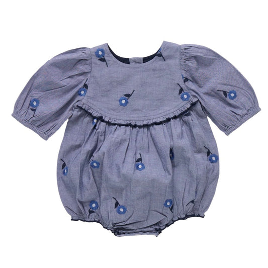 blue  baby bubble with blue floral embroidered pattern on a chambray background